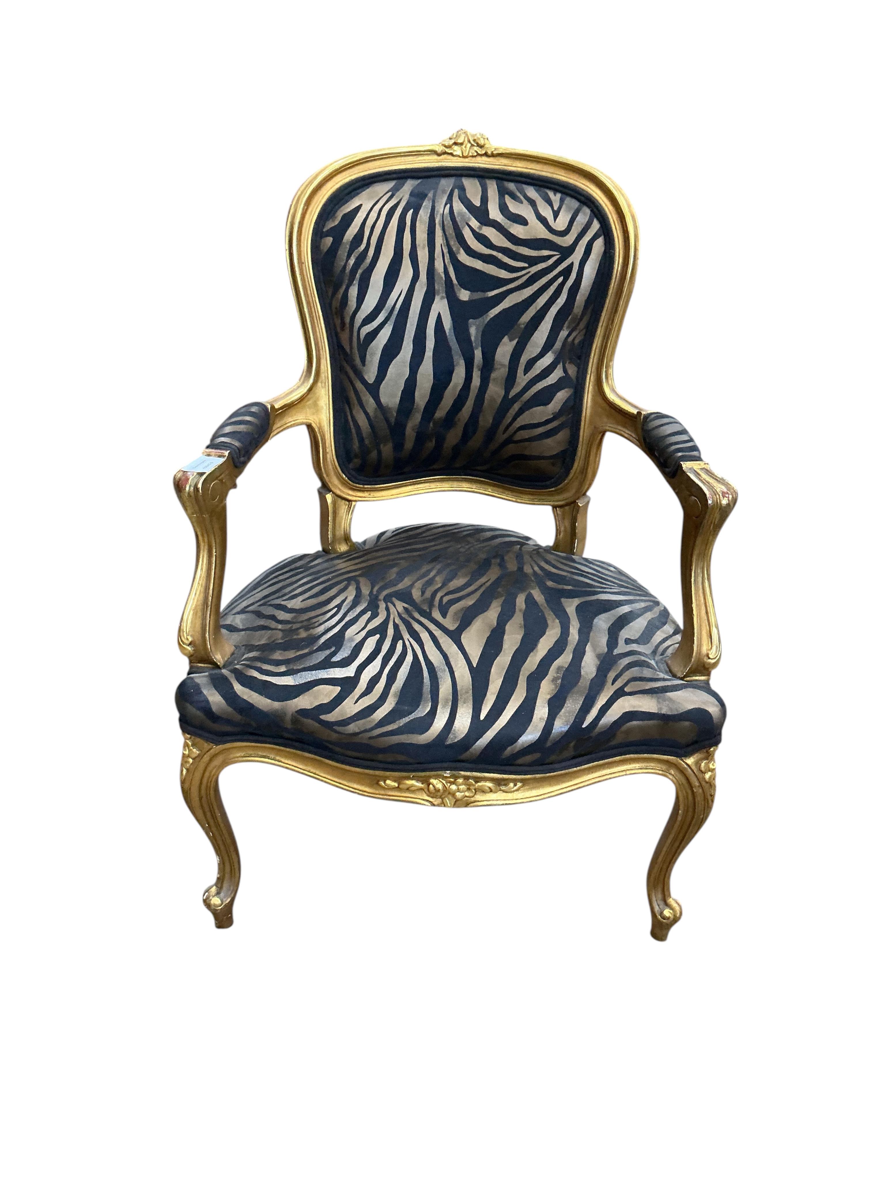 A pair of Louis XVI style fauteuil with faux zebra print upholstery, width 59cm, depth 46cm, height 92cm
